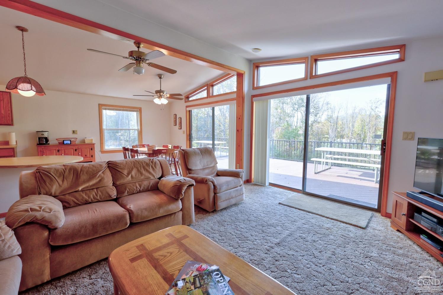 496 New Forge Road Ancram, NY 12502 - Photo 35 of 87 a living room with furniture and a flat screen tv