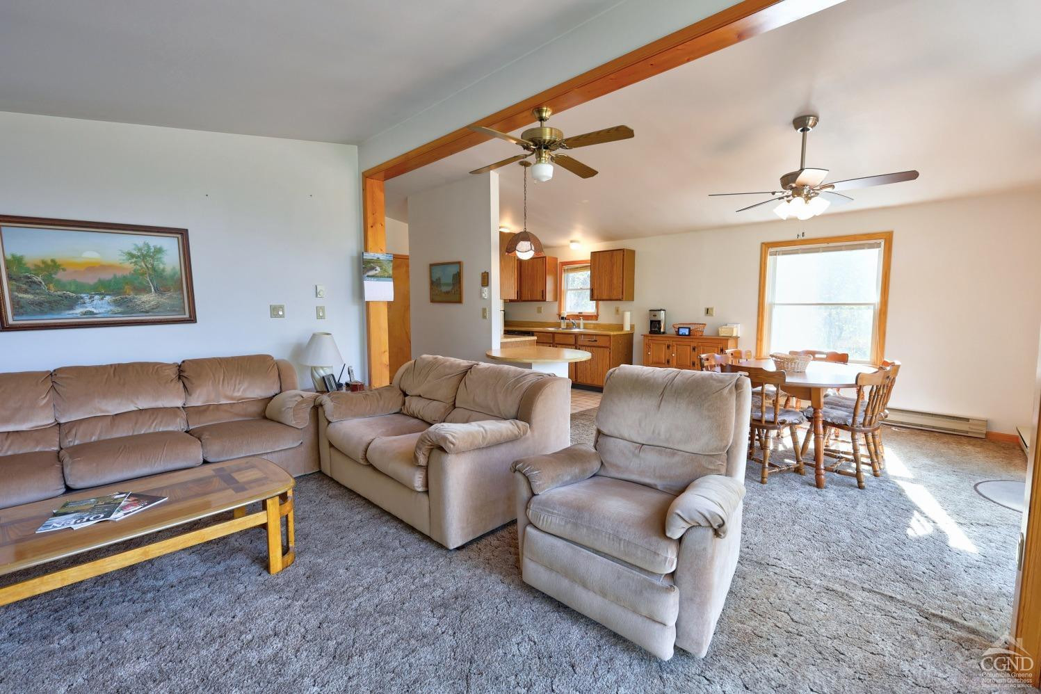 496 New Forge Road Ancram, NY 12502 - Photo 36 of 87 a living room with furniture and a large window