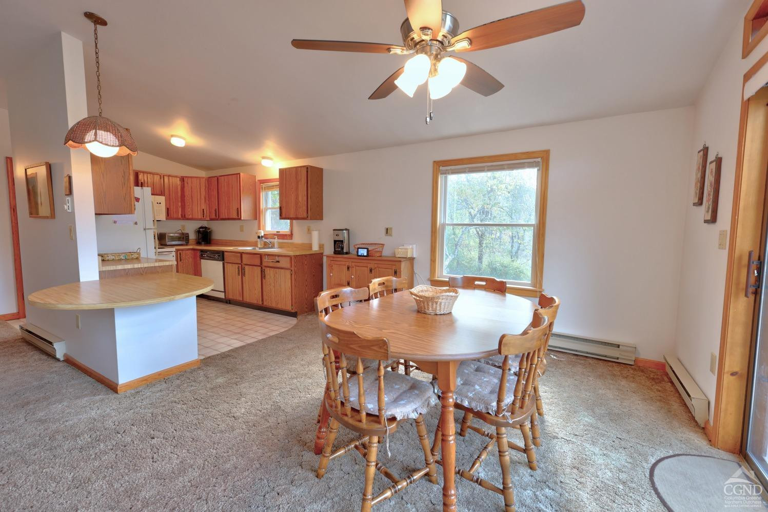 496 New Forge Road Ancram, NY 12502 - Photo 37 of 87 a view of a dining room with furniture window and wooden floor
