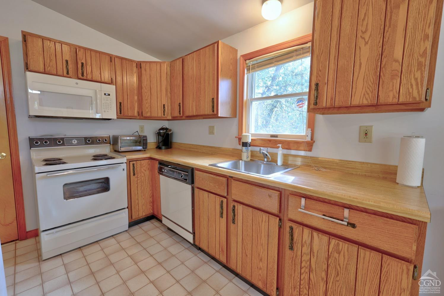 496 New Forge Road Ancram, NY 12502 - Photo 40 of 87 a kitchen with a sink stove and cabinets