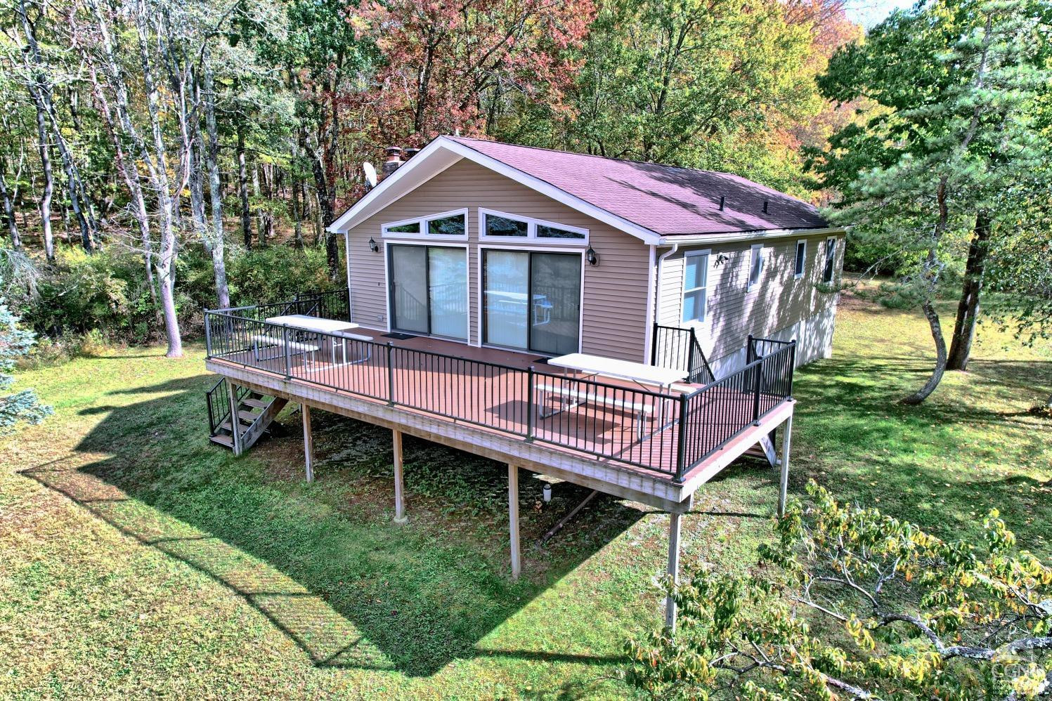 496 New Forge Road Ancram, NY 12502 - Photo 5 of 87 a view of a house with a yard and deck area
