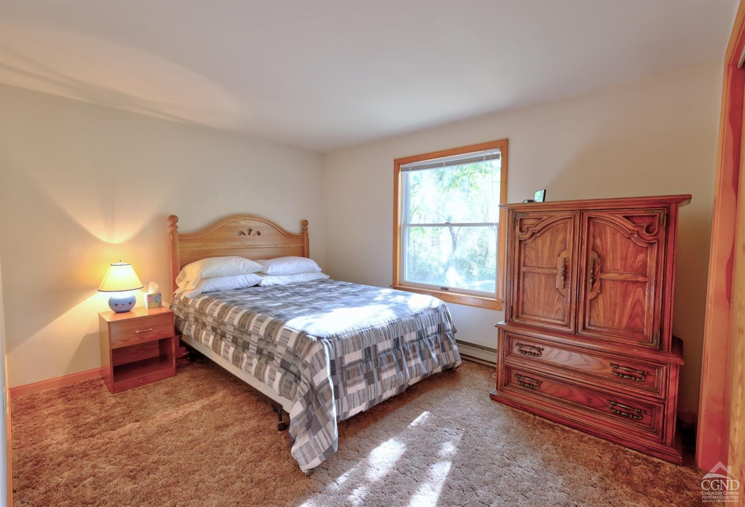496 New Forge Road Ancram, NY 12502 - Photo 51 of 87 a bedroom with a bed and wooden floor