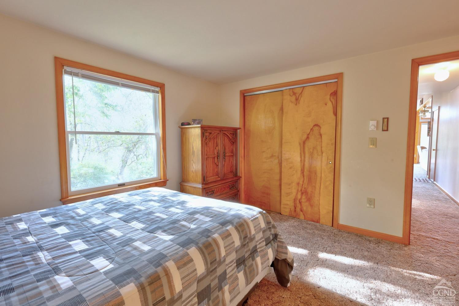 496 New Forge Road Ancram, NY 12502 - Photo 53 of 87 a bedroom with a bed and a window