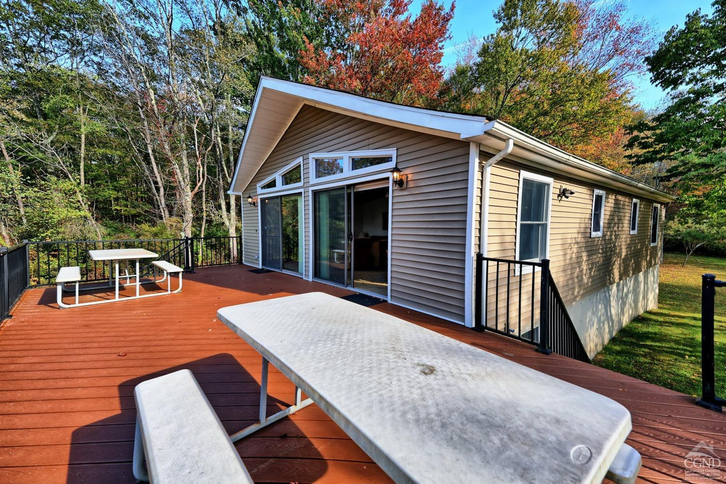 496 New Forge Road Ancram, NY 12502 - Photo 64 of 87 a view of a house with backyard and sitting area