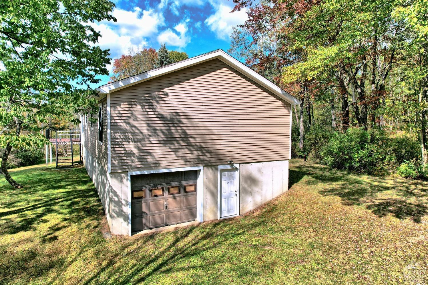 496 New Forge Road Ancram, NY 12502 - Photo 8 of 87 a view of backyard of house with green space