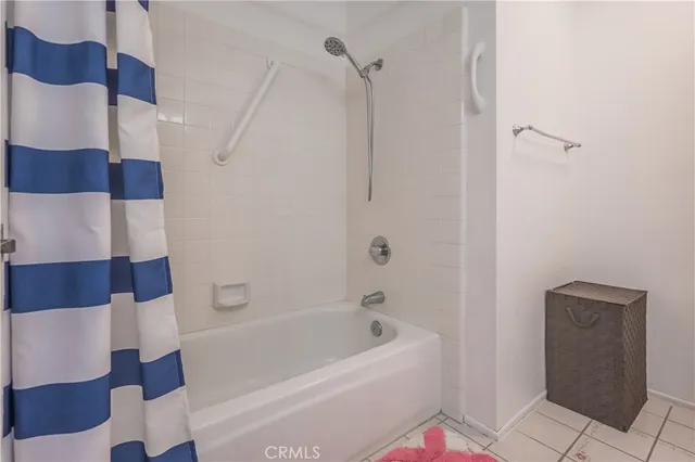 a bathroom with a bathtub and shower
