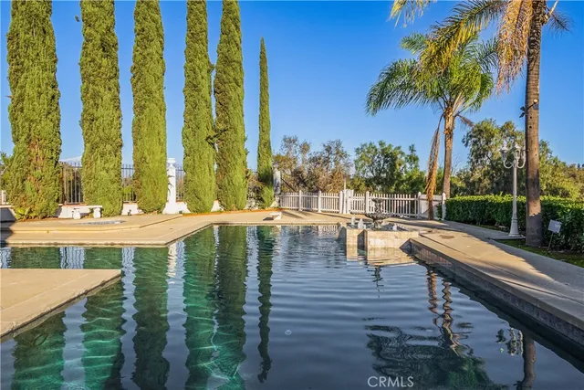 a view of swimming pool with chairs