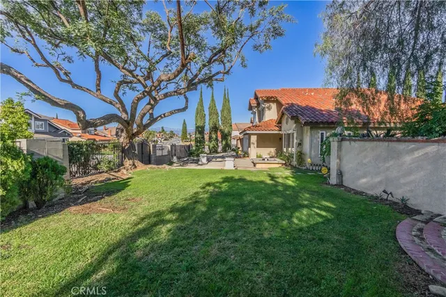 a front view of a house with patio furniture and potted plants