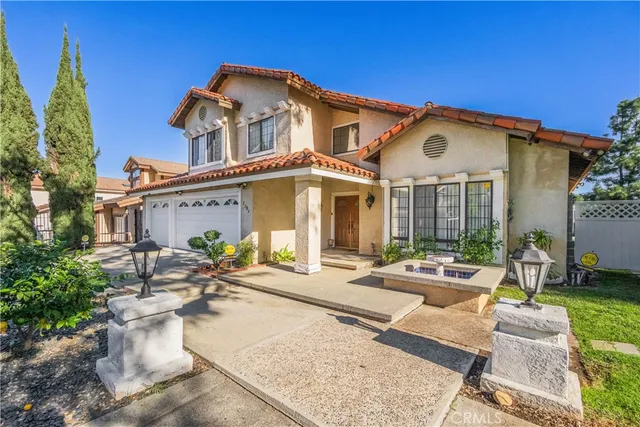 a view of a house with a fountain