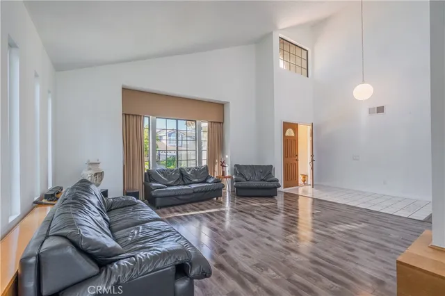 a living room with furniture window and wooden floor