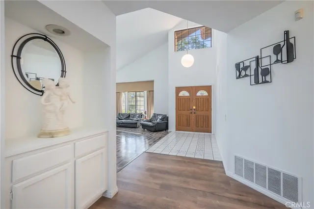 a view of a hardwood floor and a sink in a room