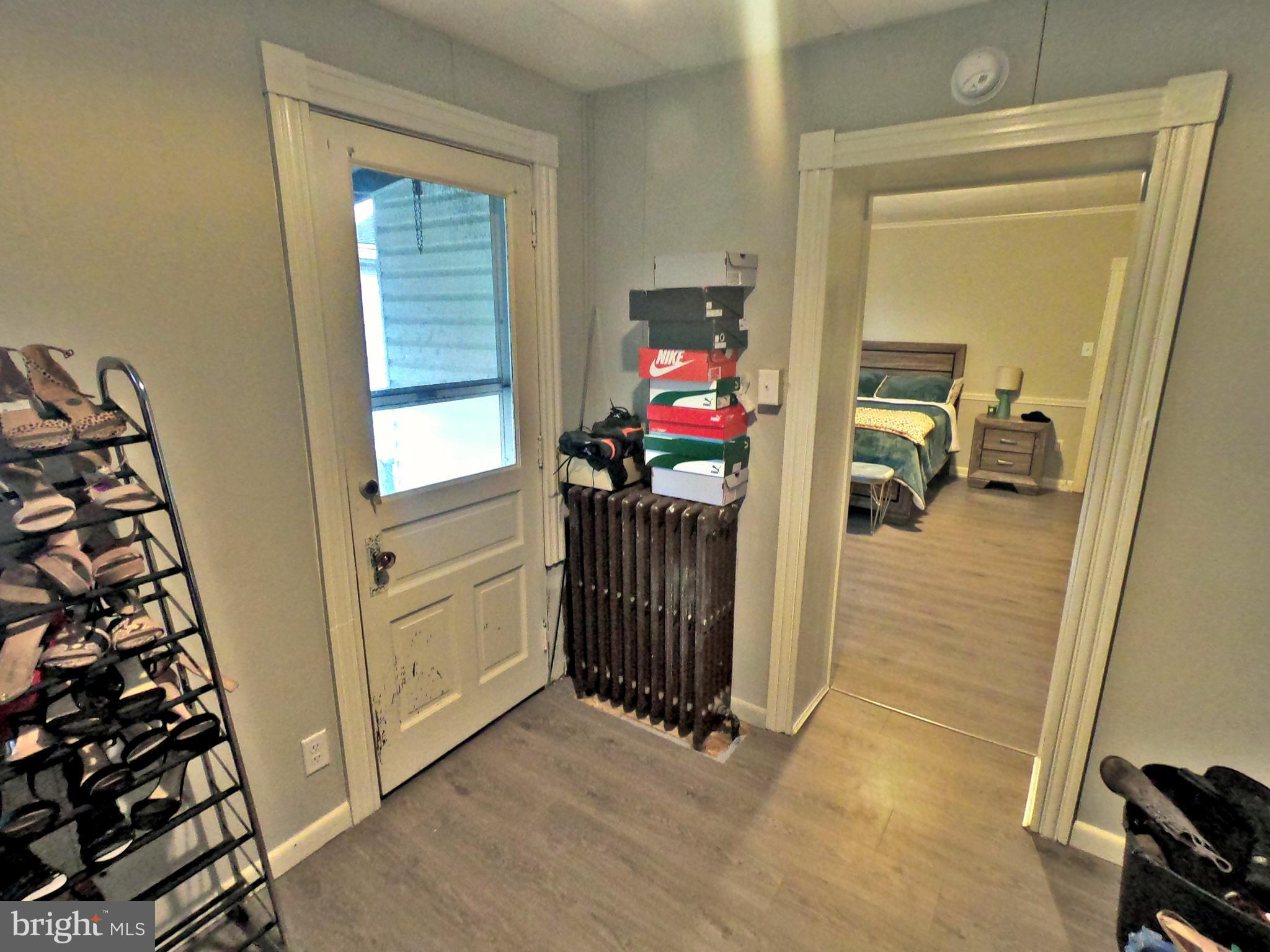 4133 Penn Avenue Sinking Spring, PA 19608 - Photo 14 of 53 a view of a hallway to a livingroom and a livingroom with furniture