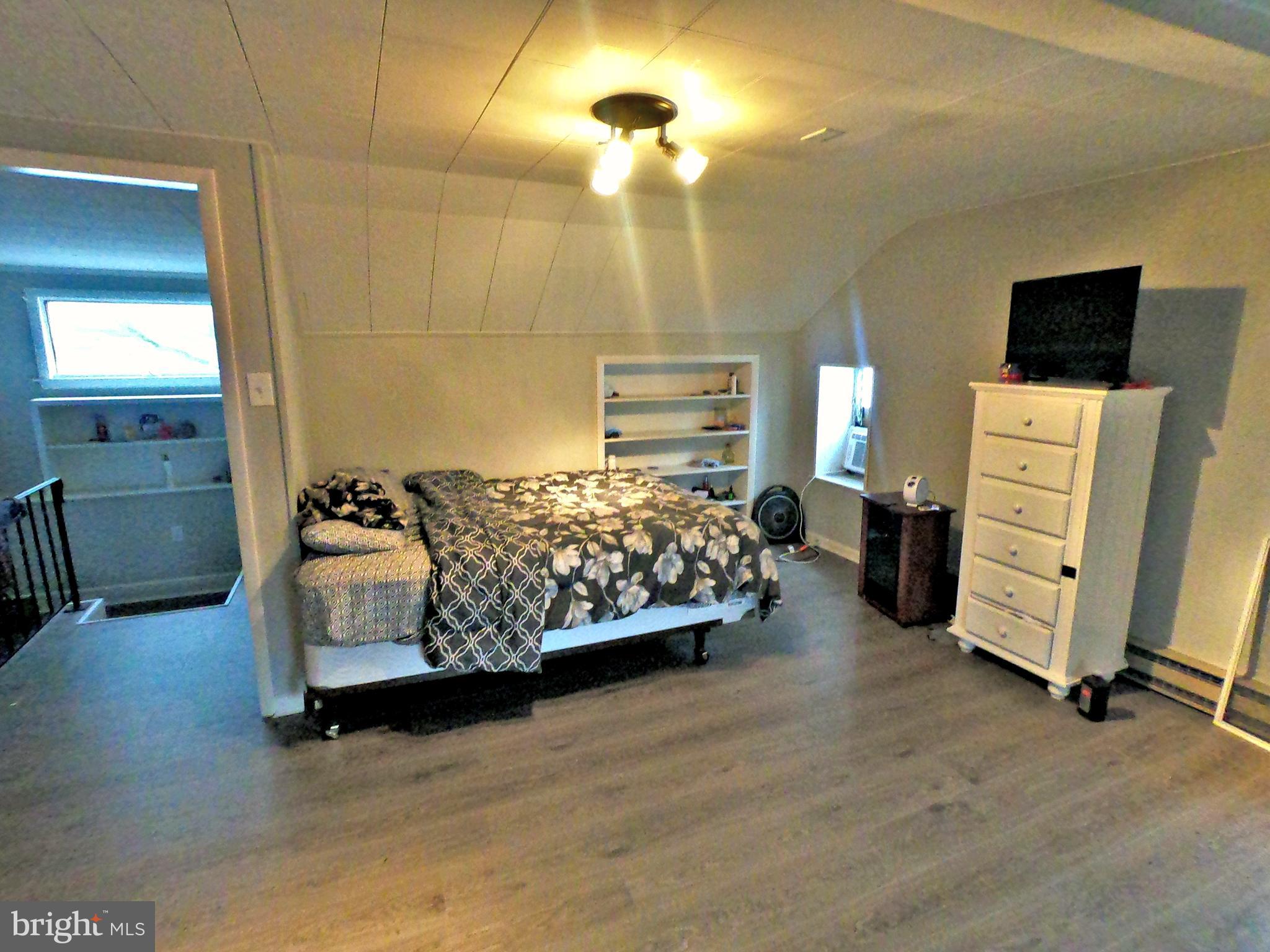 4133 Penn Avenue Sinking Spring, PA 19608 - Photo 16 of 53 a bedroom with bed and wooden floor