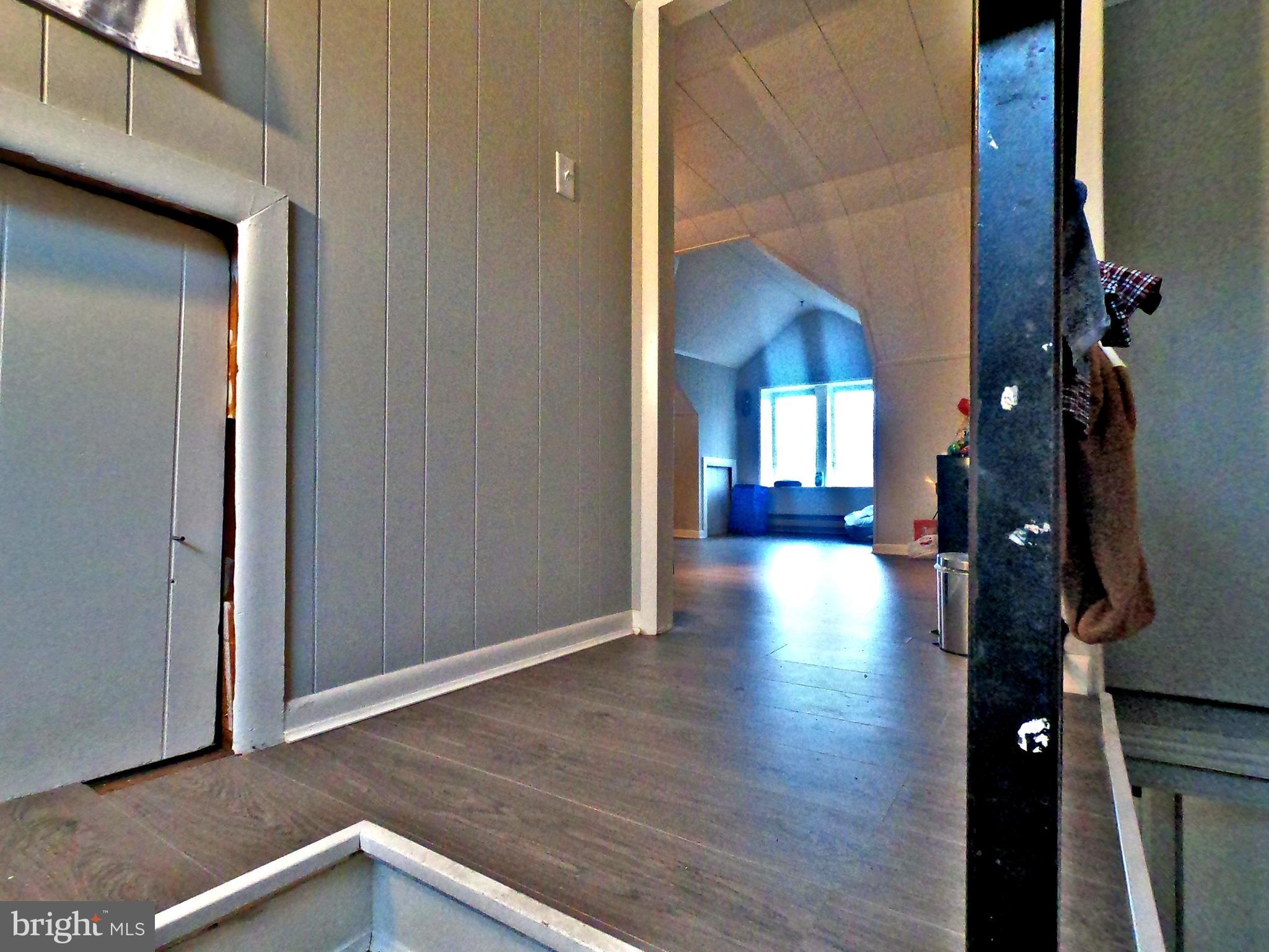 4133 Penn Avenue Sinking Spring, PA 19608 - Photo 21 of 53 a view of a hallway with wooden floor