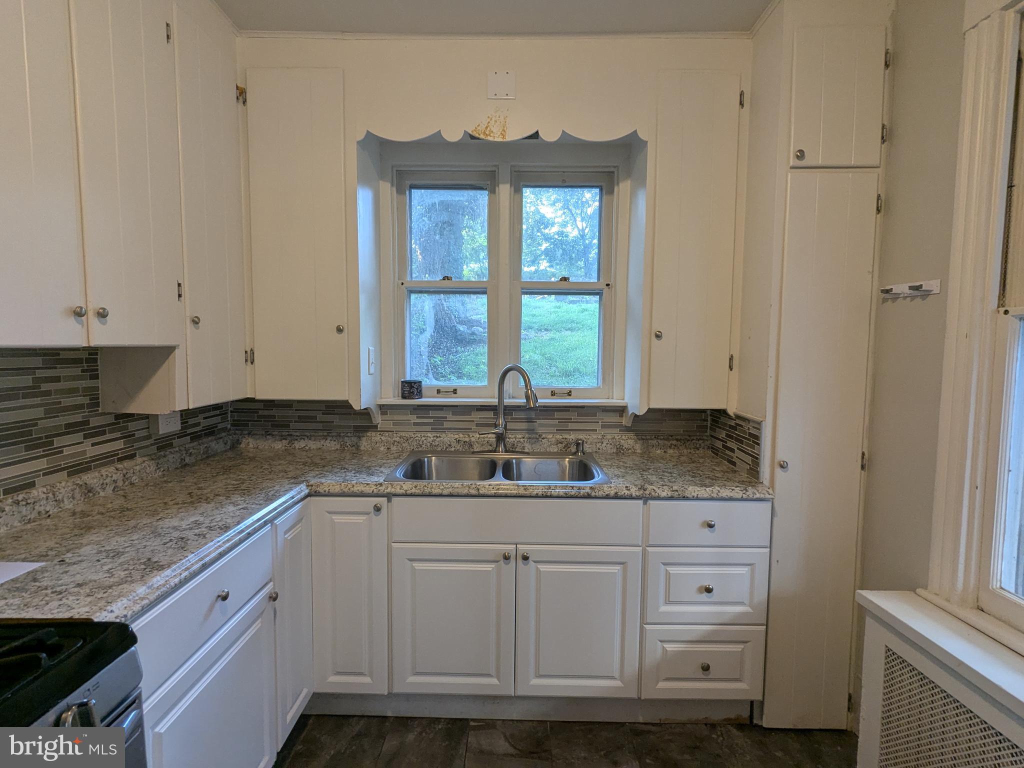 4133 Penn Avenue Sinking Spring, PA 19608 - Photo 27 of 53 a kitchen with granite countertop a sink and a stove