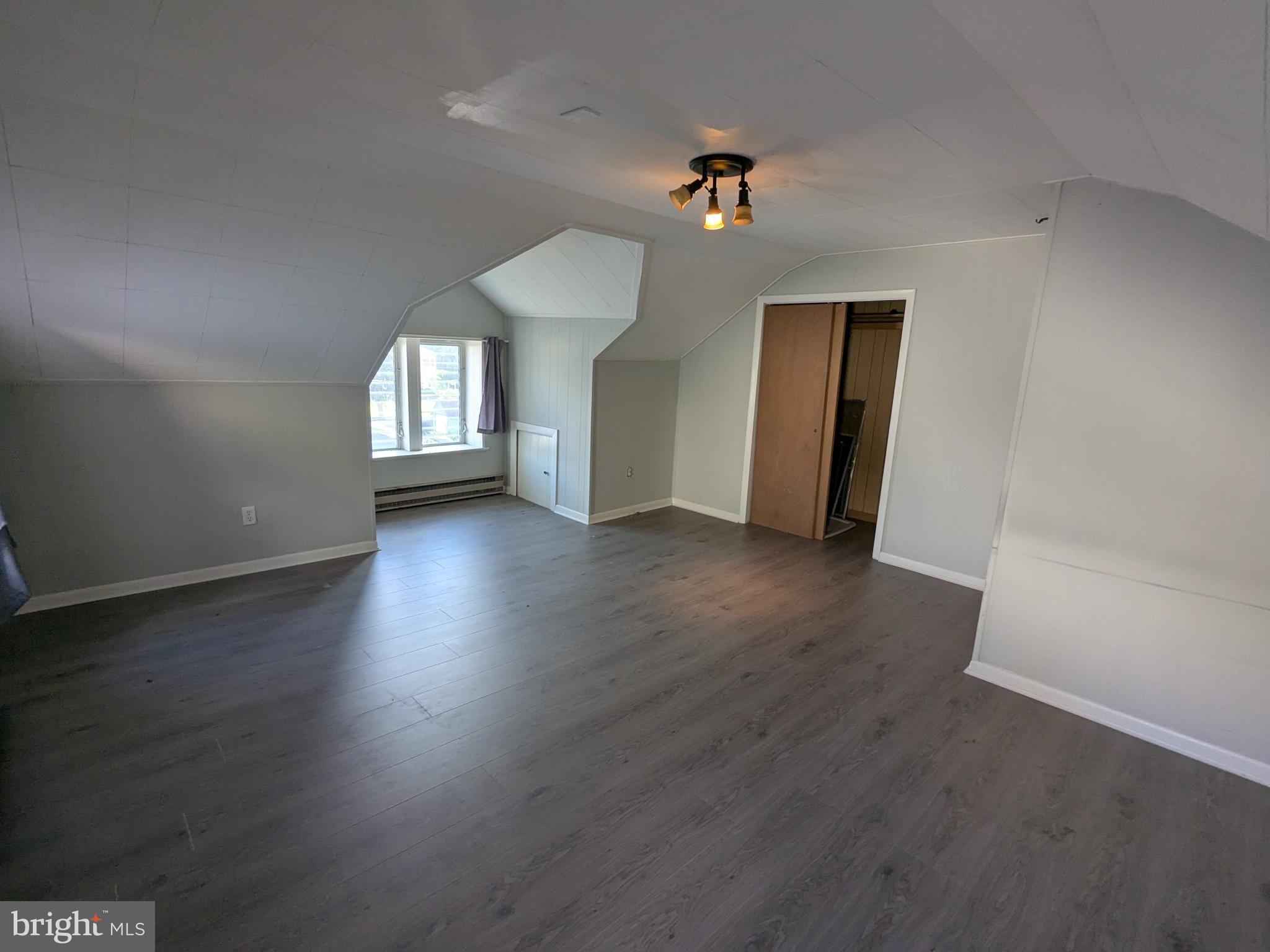 4133 Penn Avenue Sinking Spring, PA 19608 - Photo 38 of 53 an empty room with wooden floor and windows