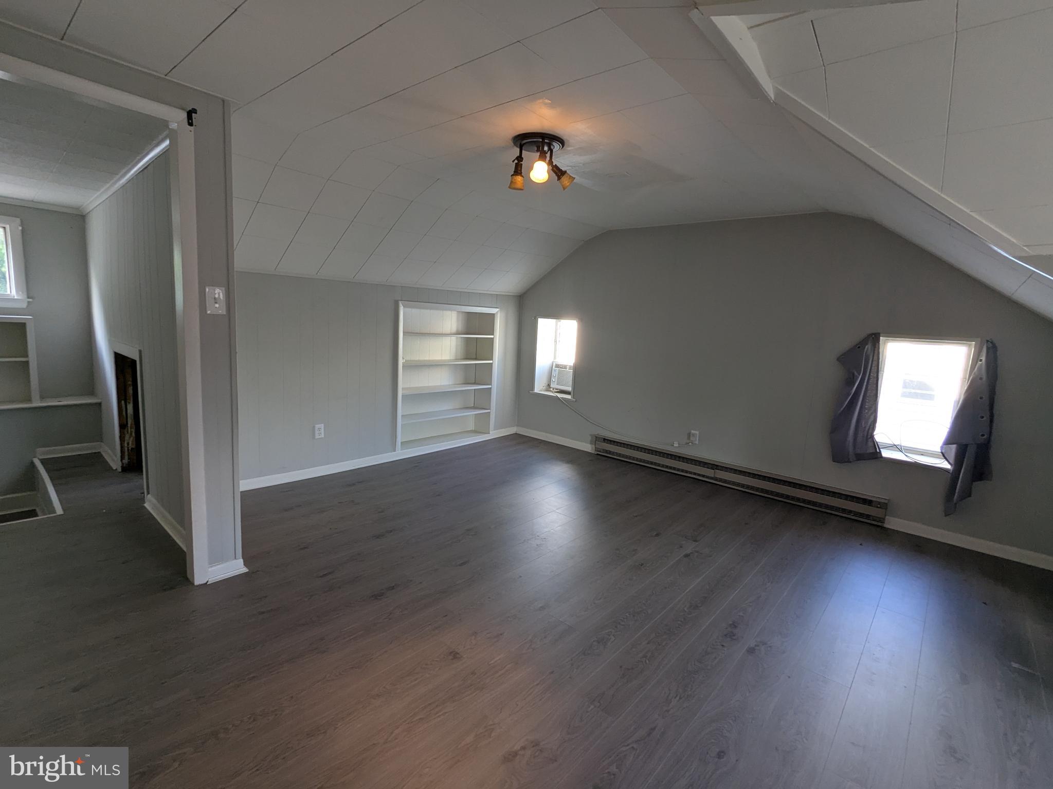 4133 Penn Avenue Sinking Spring, PA 19608 - Photo 39 of 53 an empty room with wooden floor and windows