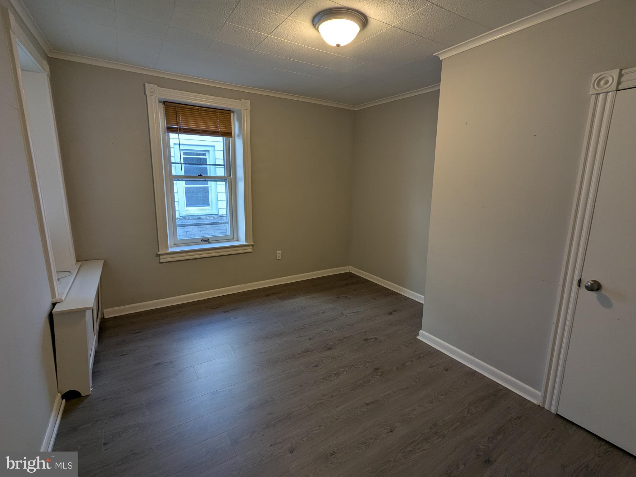 4133 Penn Avenue Sinking Spring, PA 19608 - Photo 40 of 53 an empty room with wooden floor and windows