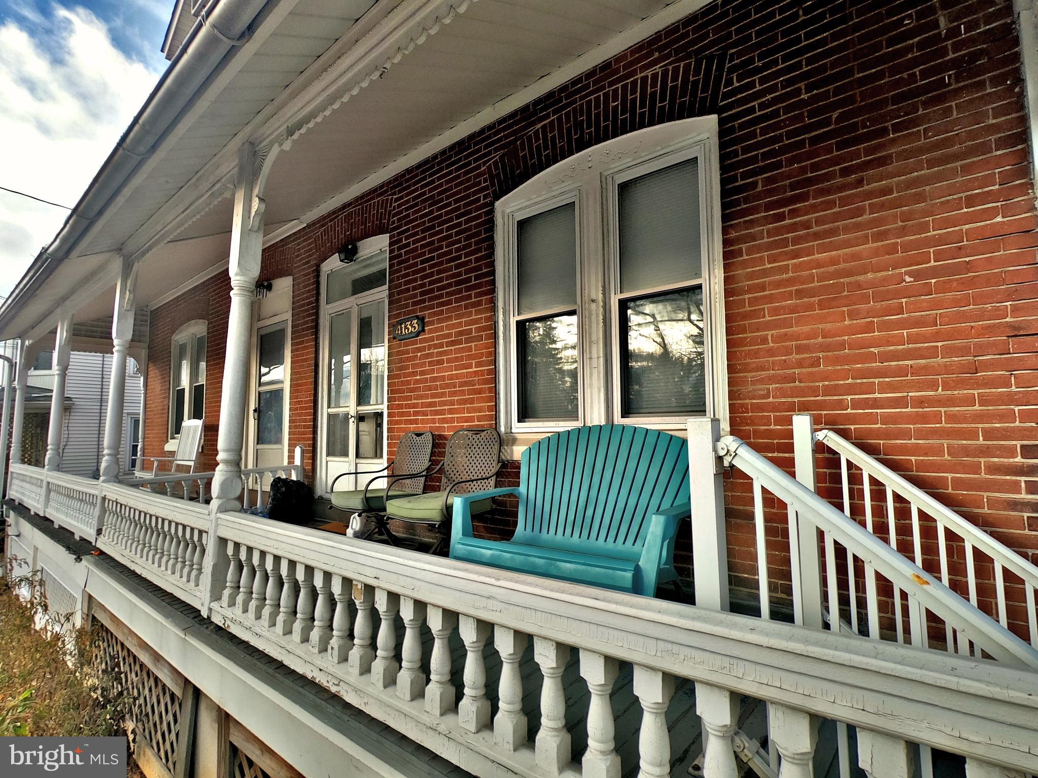 4133 Penn Avenue Sinking Spring, PA 19608 - Photo 4 of 53 a view of a brick house with large windows