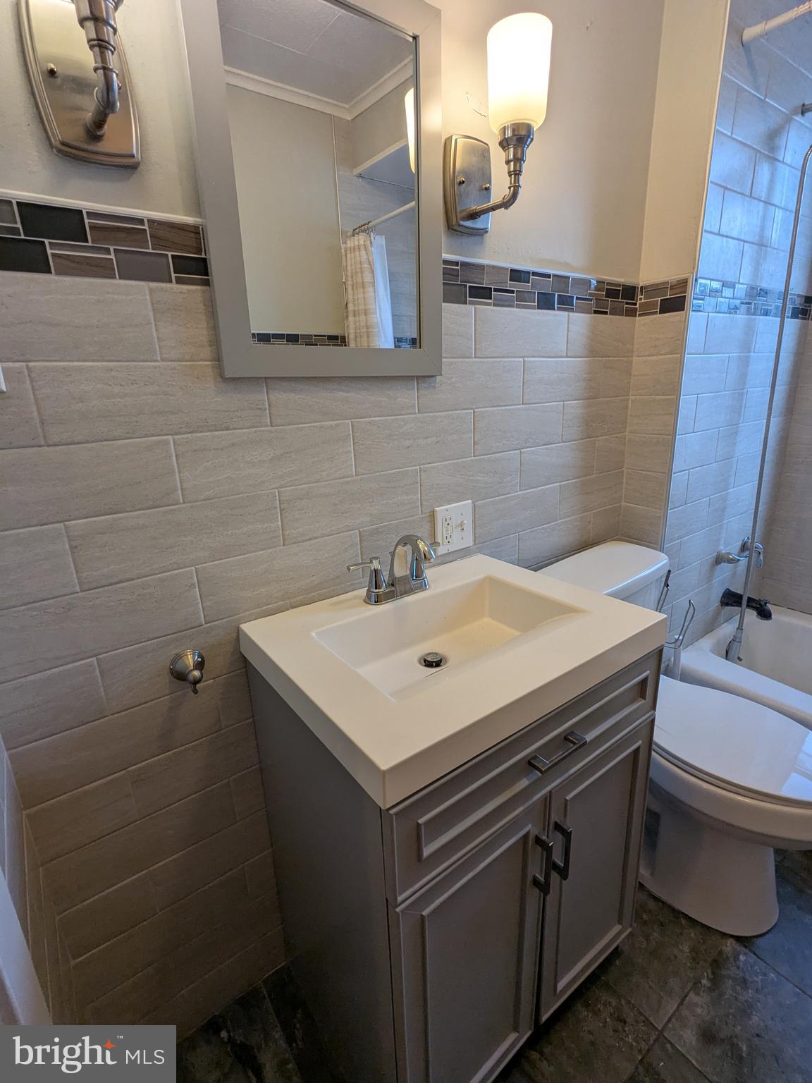 4133 Penn Avenue Sinking Spring, PA 19608 - Photo 45 of 53 a bathroom with a sink toilet and mirror