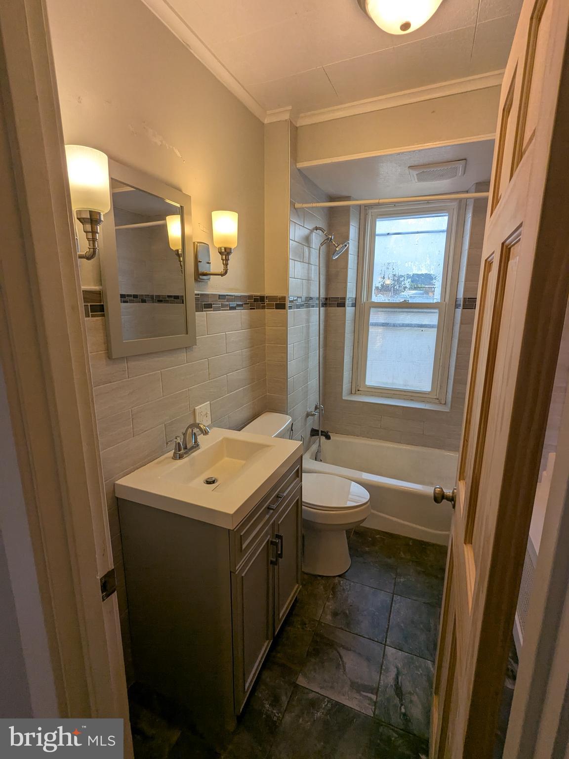 4133 Penn Avenue Sinking Spring, PA 19608 - Photo 46 of 53 a bathroom with a toilet sink and mirror