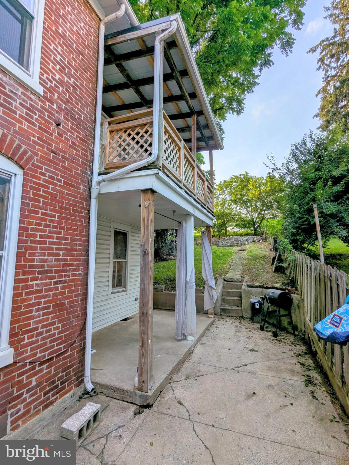 4133 Penn Avenue Sinking Spring, PA 19608 - Photo 49 of 53 a view of a house with a balcony and wooden fence