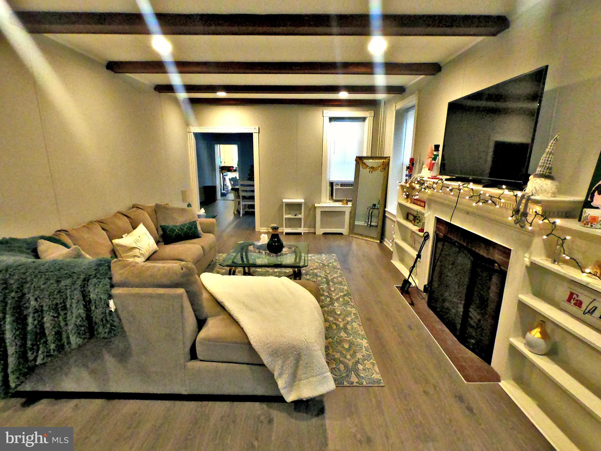 4133 Penn Avenue Sinking Spring, PA 19608 - Photo 5 of 53 a living room with furniture and a flat screen tv