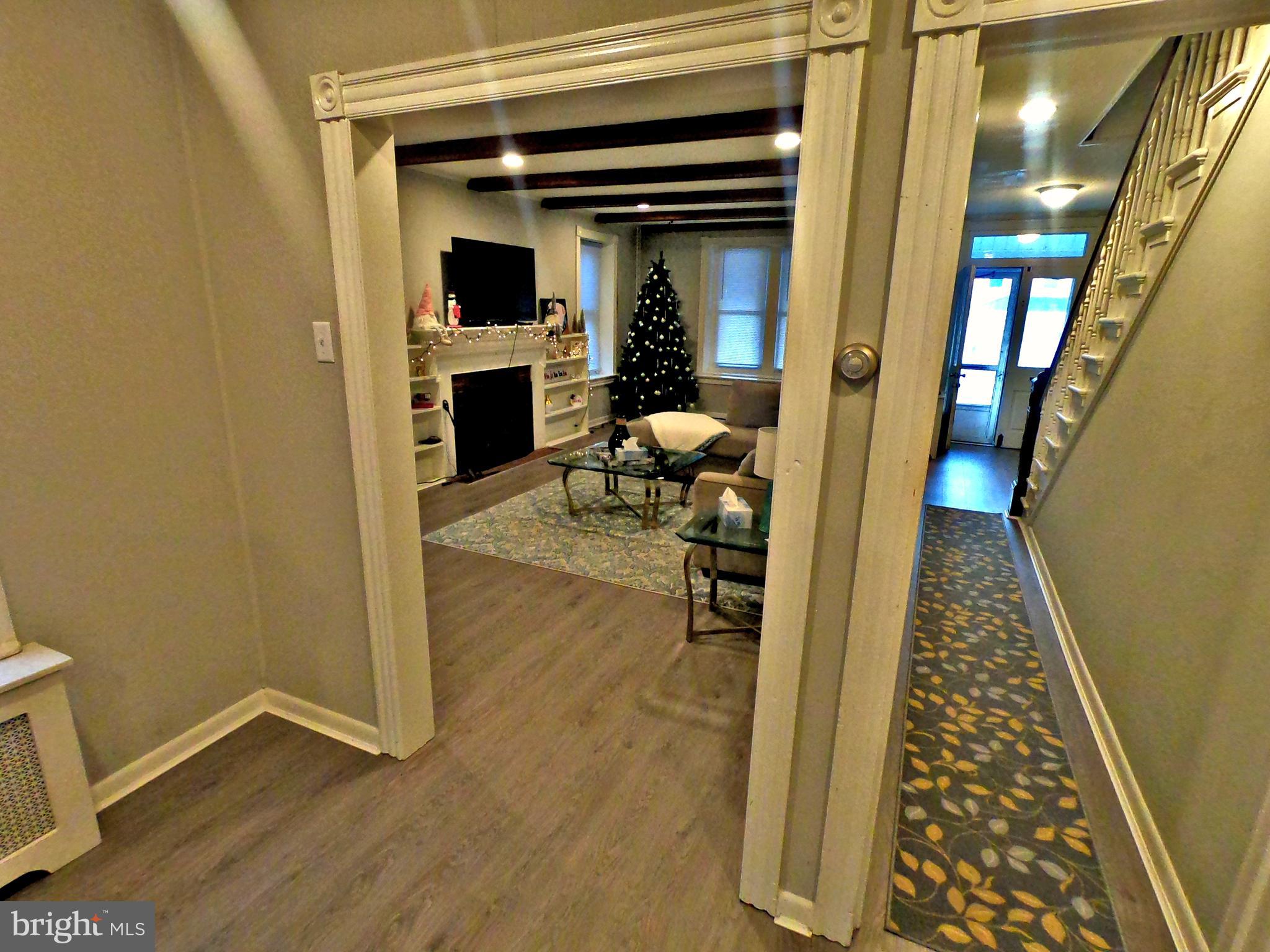 4133 Penn Avenue Sinking Spring, PA 19608 - Photo 7 of 53 a view of a hallway and wooden floor a living room