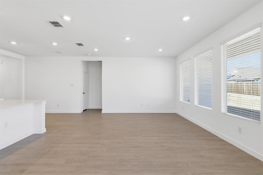 4912 Ascot Way Princeton, TX 75407 - Photo 21 of 35 an empty room with windows and closet