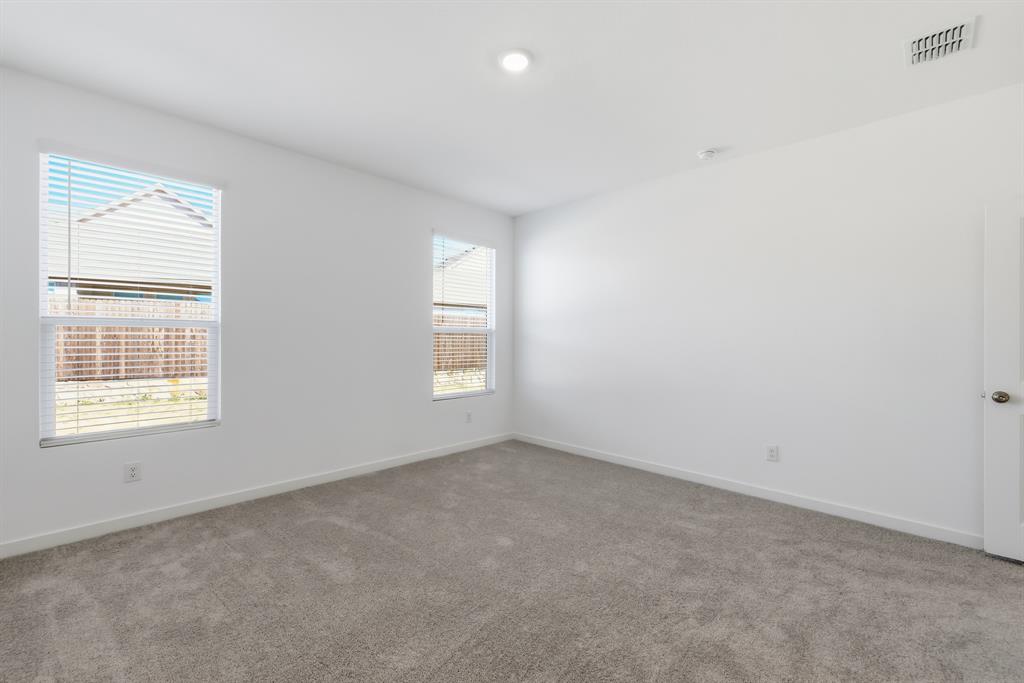 4912 Ascot Way Princeton, TX 75407 - Photo 23 of 35 an empty room with a window