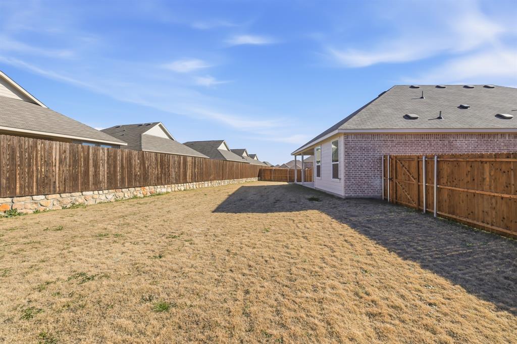 4912 Ascot Way Princeton, TX 75407 - Photo 30 of 35 a backyard of a house