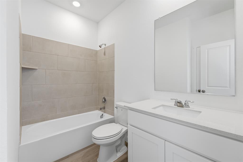 4912 Ascot Way Princeton, TX 75407 - Photo 5 of 35 a bathroom with a sink a toilet and bathtub
