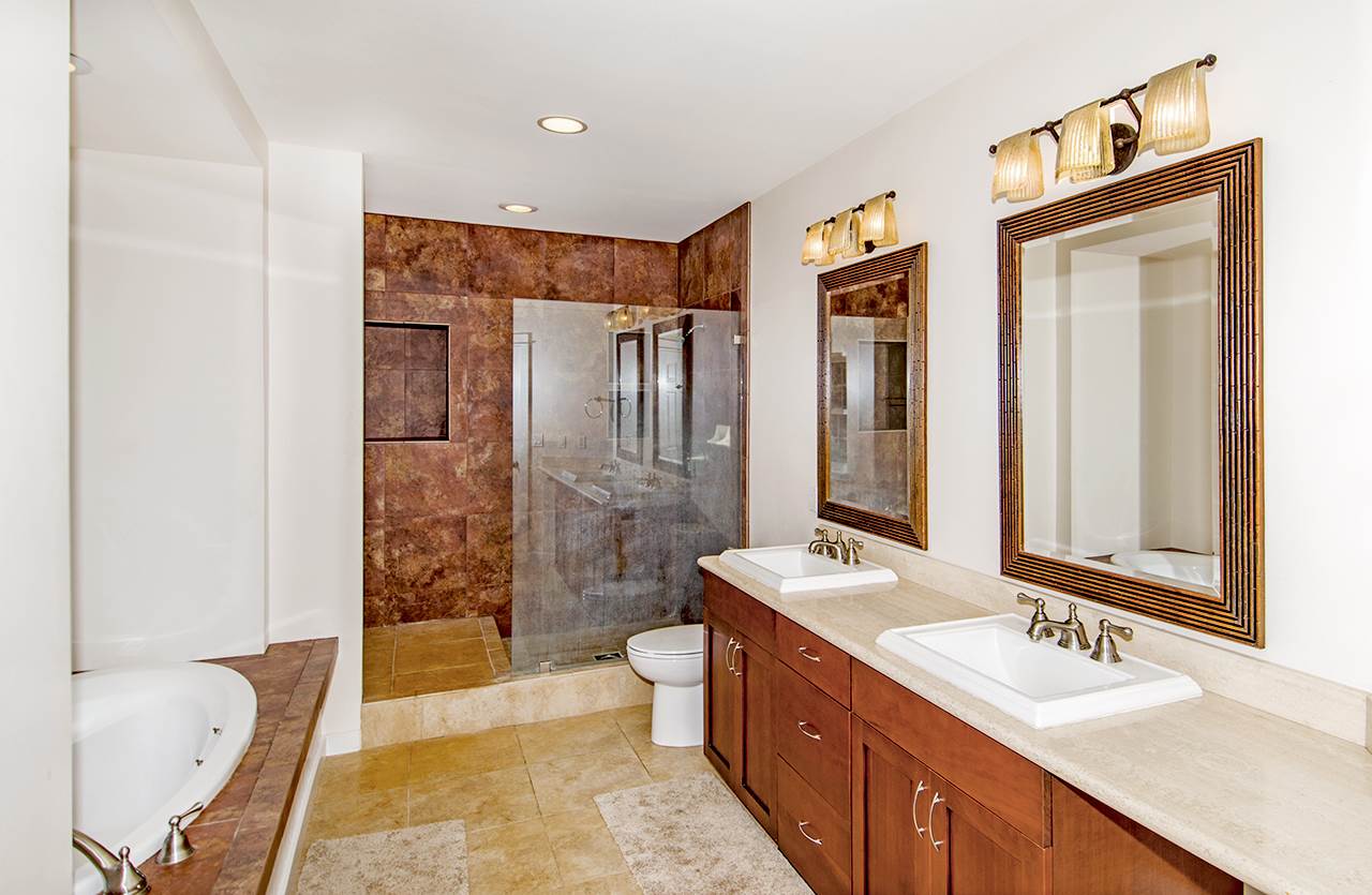 230-240 Mauu Place Haiku, HI 96708 - Photo 12 of 16 a spacious bathroom with a double vanity sink mirror and shower