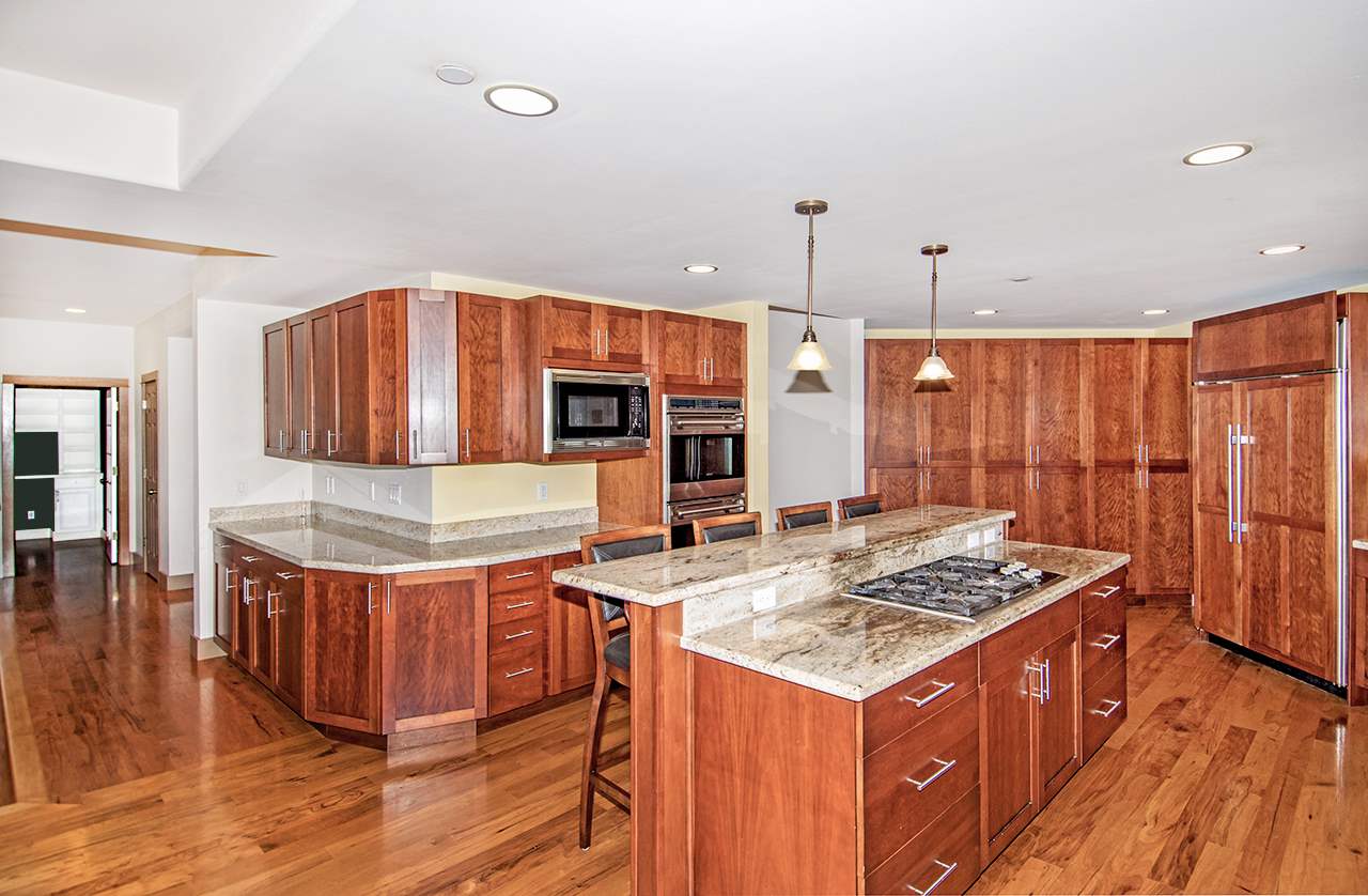 230-240 Mauu Place Haiku, HI 96708 - Photo 6 of 16 a open kitchen with stainless steel appliances granite countertop a stove and a refrigerator