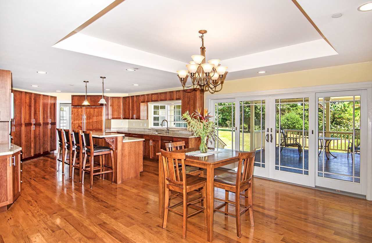 230-240 Mauu Place Haiku, HI 96708 - Photo 7 of 16 a view of a dining room with furniture wooden floor and chandelier