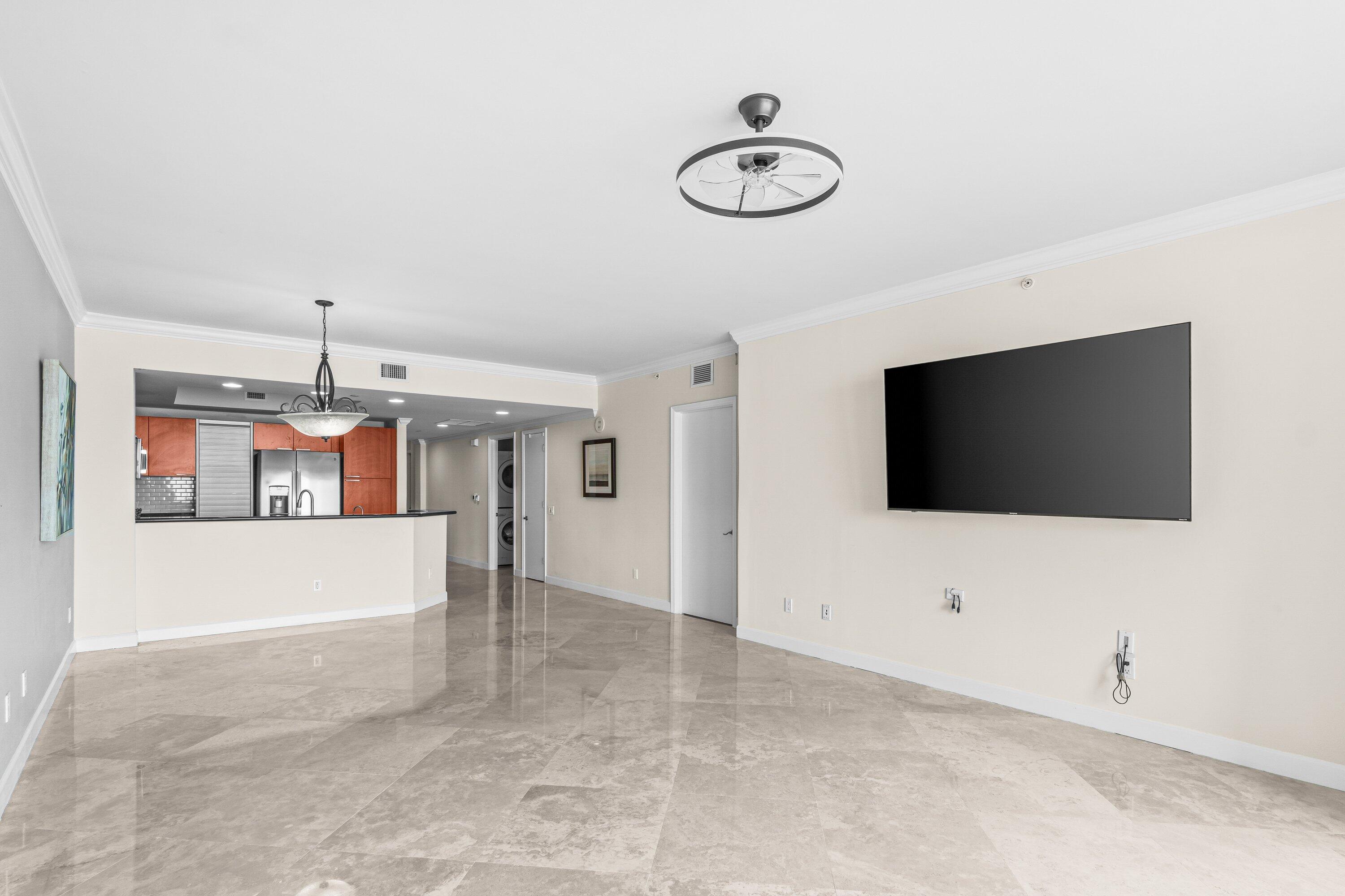 2650 Lake Shore Drive, Unit 703 Riviera Beach, FL 33404 - Photo 11 of 56 a view of an empty room with a flat screen tv