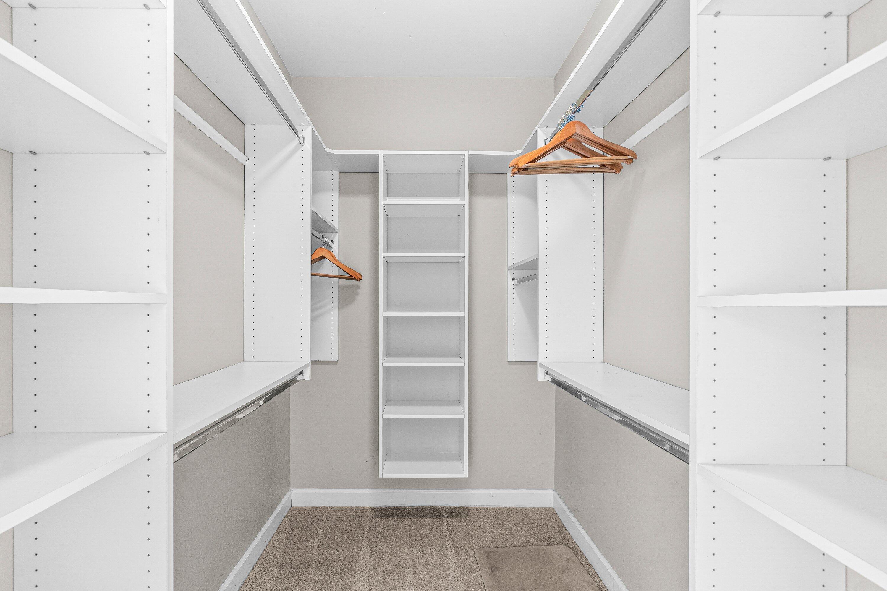 2650 Lake Shore Drive, Unit 703 Riviera Beach, FL 33404 - Photo 17 of 56 a view of walk in closet with empty racks
