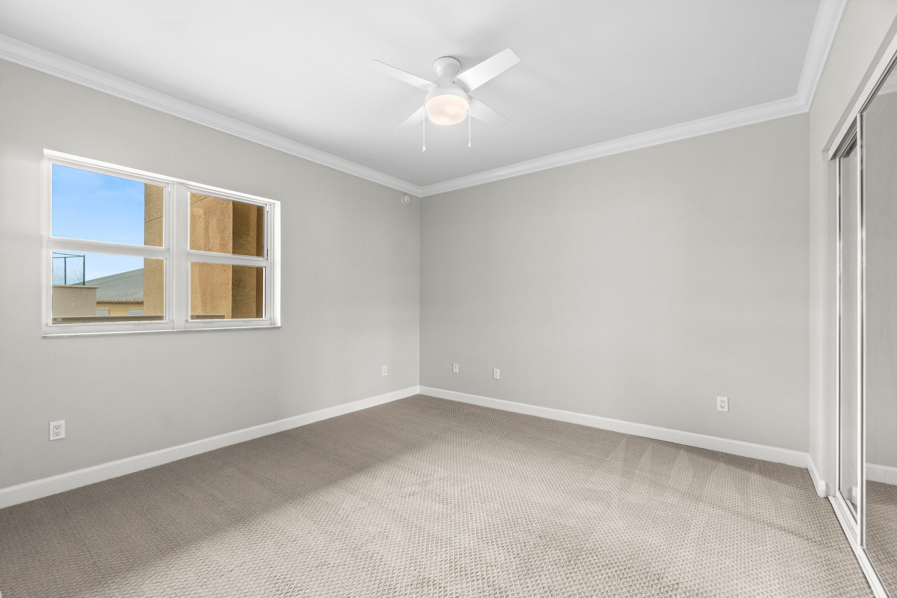 2650 Lake Shore Drive, Unit 703 Riviera Beach, FL 33404 - Photo 20 of 56 a view of an empty room with a window