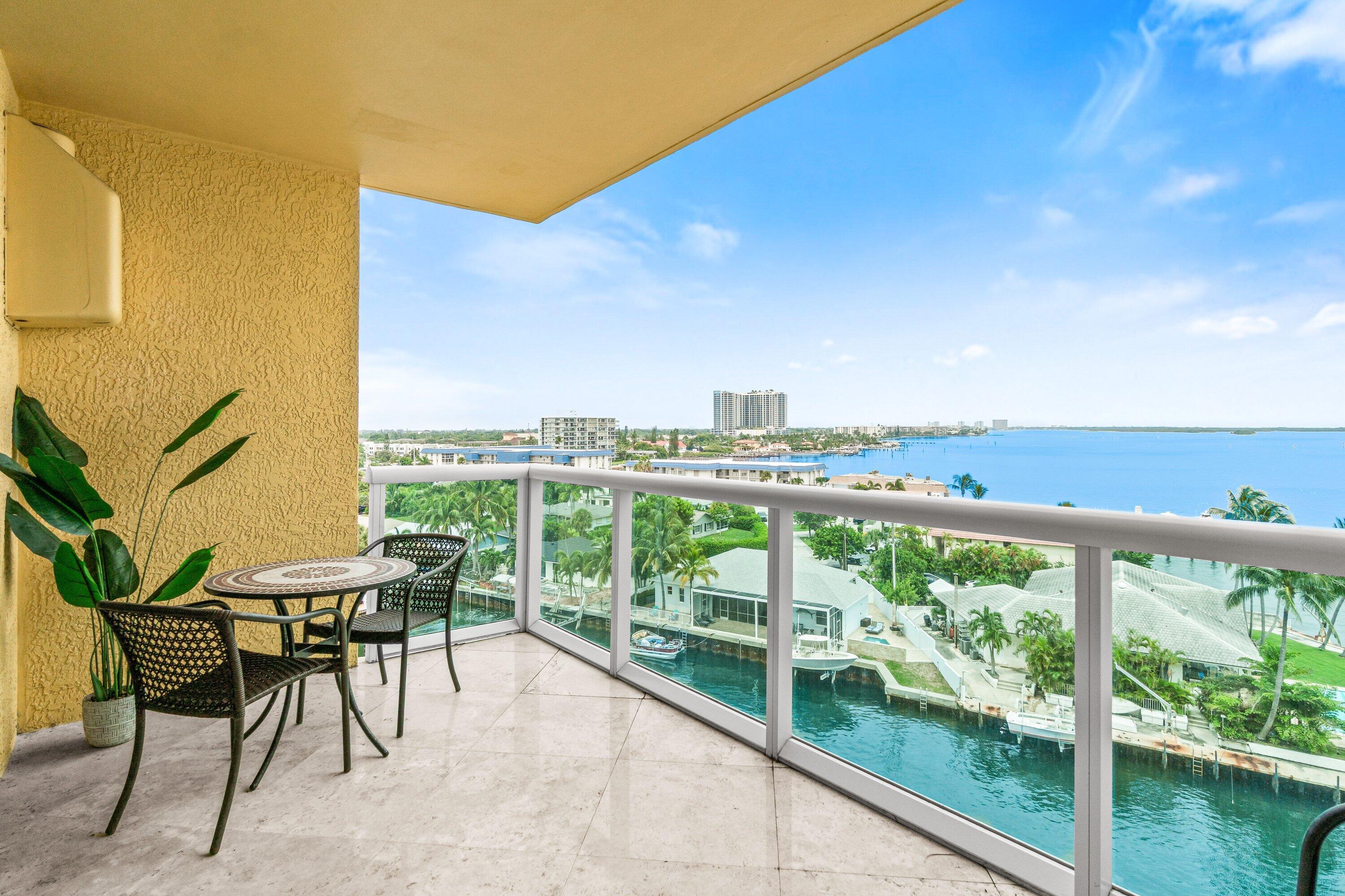 2650 Lake Shore Drive, Unit 703 Riviera Beach, FL 33404 - Photo 2 of 56 a view of a chairs and table in patio