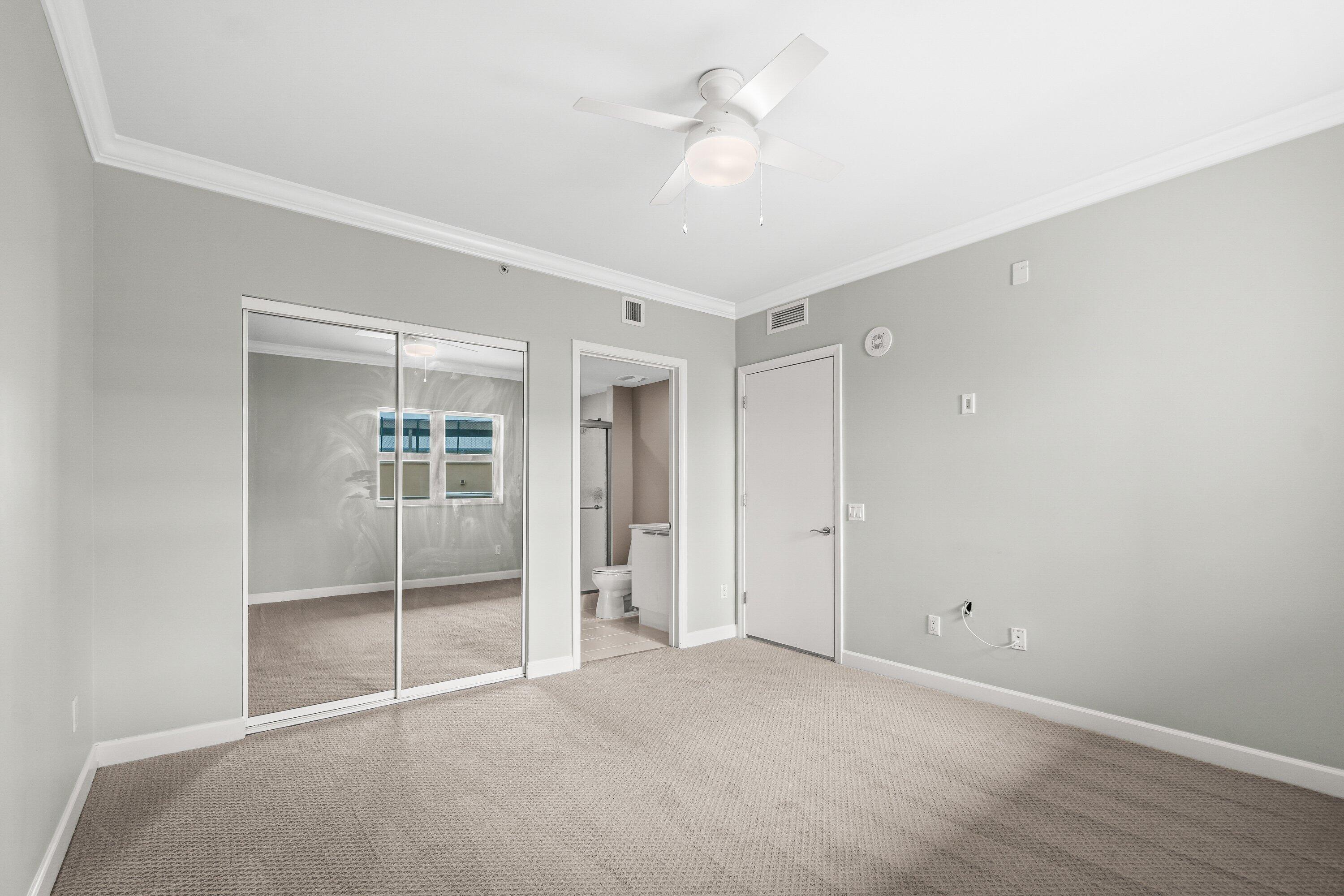 2650 Lake Shore Drive, Unit 703 Riviera Beach, FL 33404 - Photo 21 of 56 a view of an empty room with a window