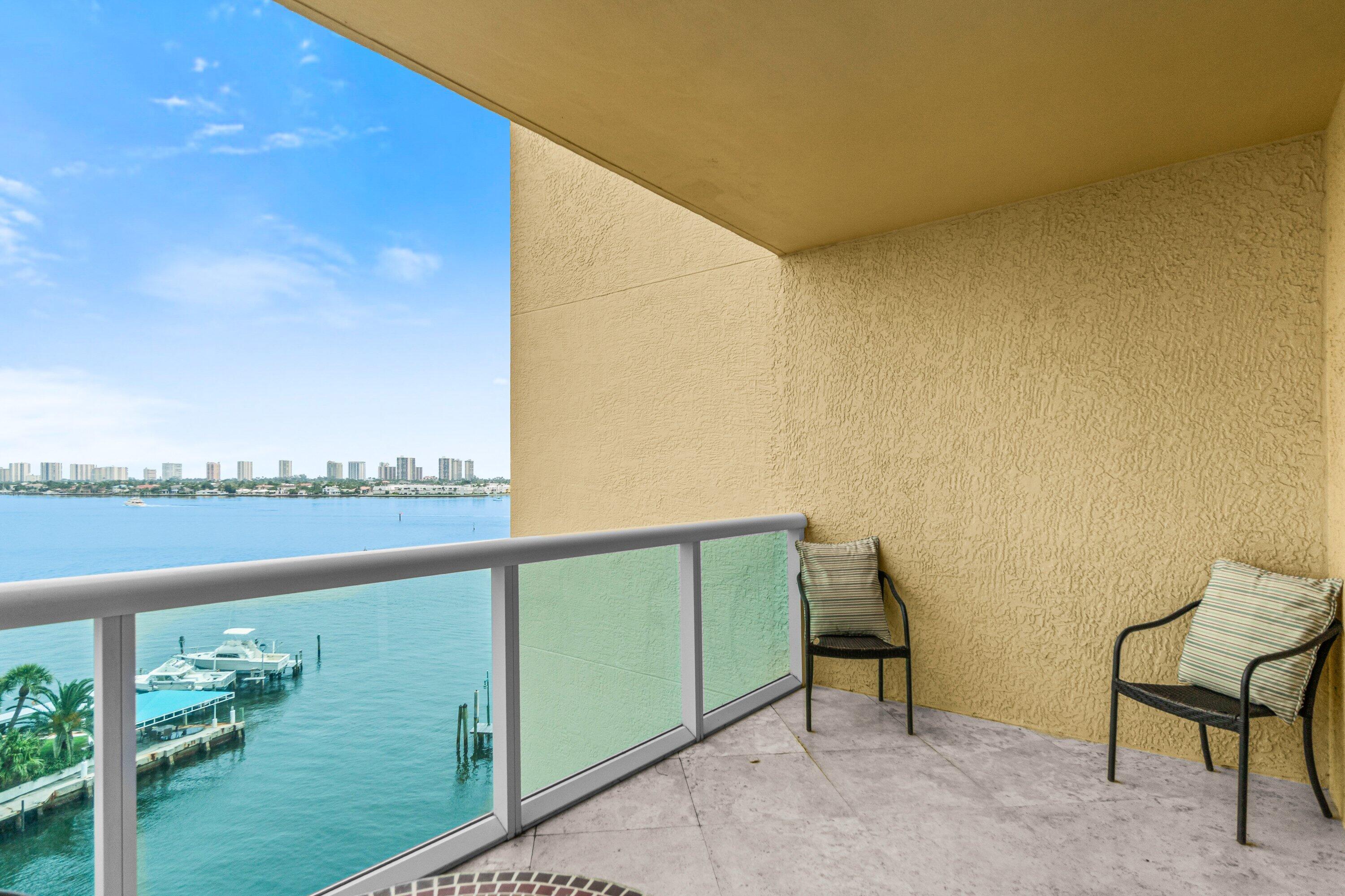 2650 Lake Shore Drive, Unit 703 Riviera Beach, FL 33404 - Photo 28 of 56 a view of a chair and table in balcony