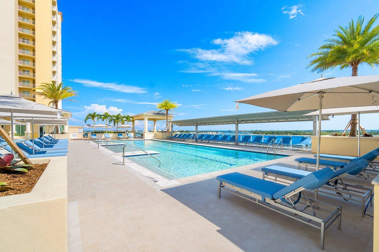 2650 Lake Shore Drive, Unit 703 Riviera Beach, FL 33404 - Photo 38 of 56 a view of a patio with swimming pool