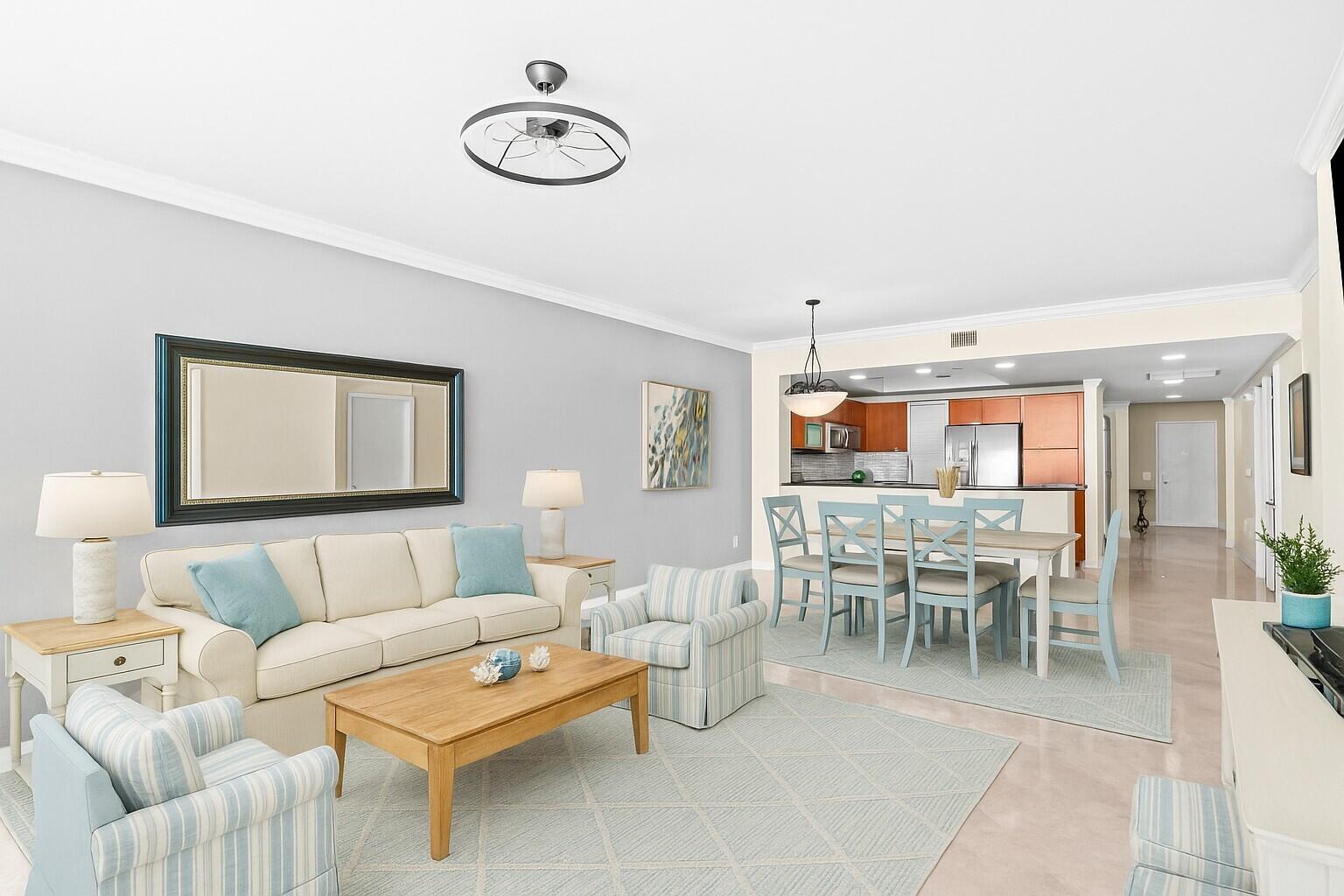 2650 Lake Shore Drive, Unit 703 Riviera Beach, FL 33404 - Photo 4 of 56 a living room with furniture kitchen view and a window
