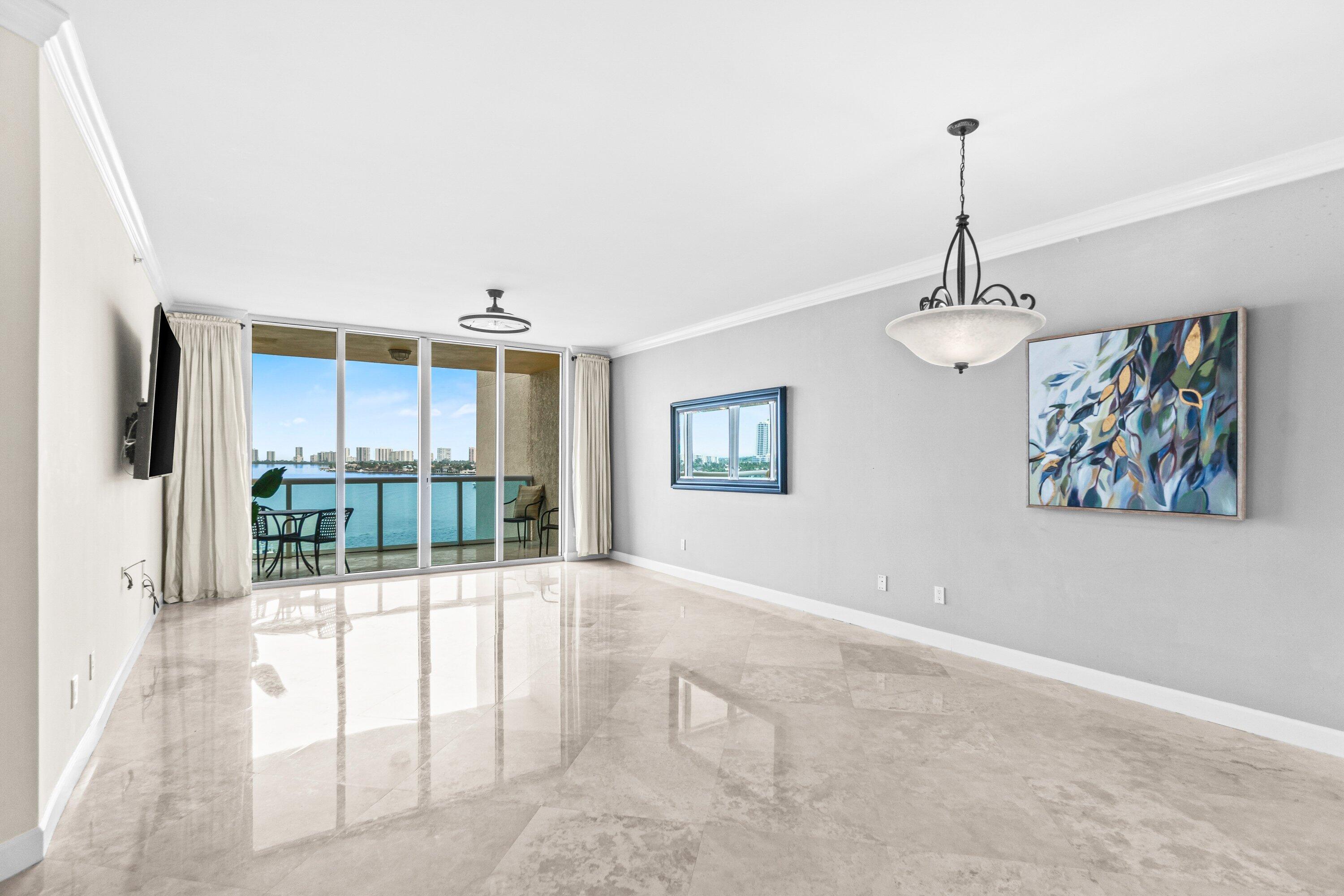 2650 Lake Shore Drive, Unit 703 Riviera Beach, FL 33404 - Photo 5 of 56 a view of a livingroom with a furniture
