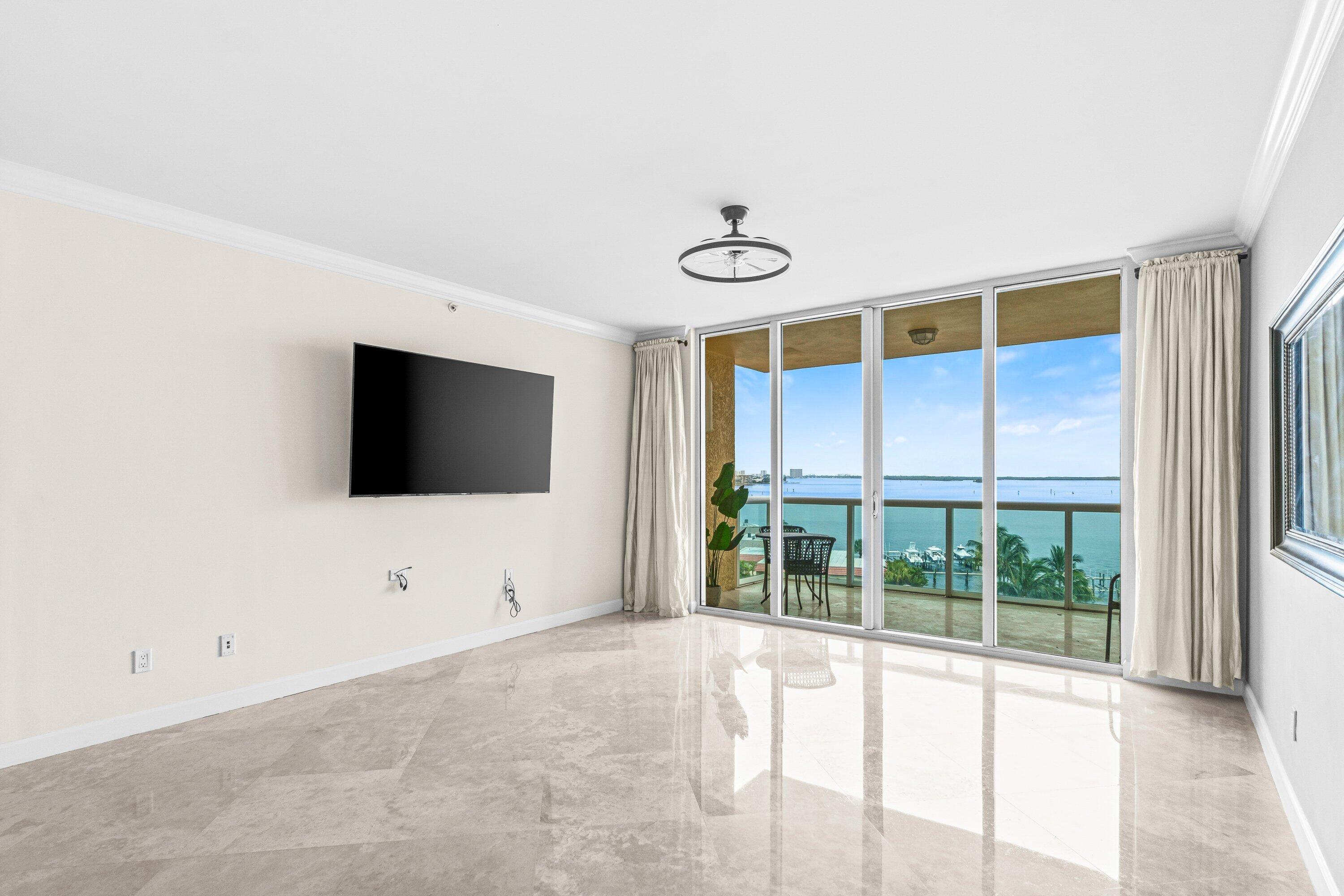 2650 Lake Shore Drive, Unit 703 Riviera Beach, FL 33404 - Photo 10 of 56 a view of an empty room with a flat screen tv