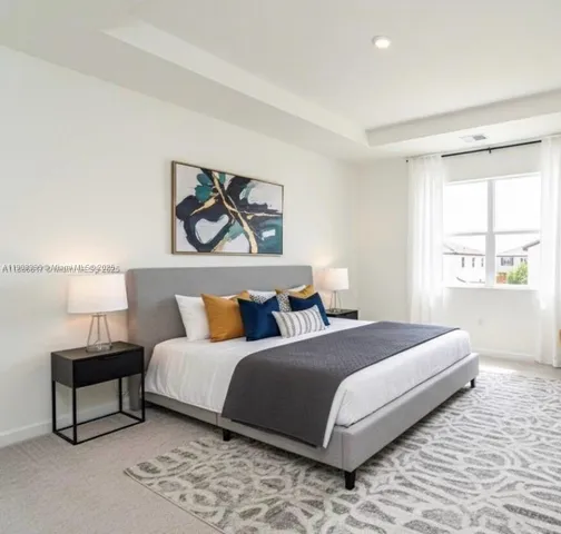 a bedroom with bed and a window