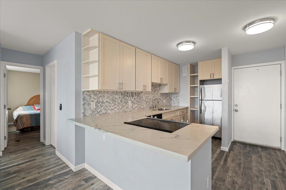 111 Kahului Beach Road, Unit D412 Kahului, HI 96732 - Photo 19 of 37 a kitchen with a sink a stove and refrigerator