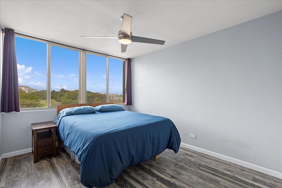 111 Kahului Beach Road, Unit D412 Kahului, HI 96732 - Photo 24 of 37 a bedroom with a bed and large window