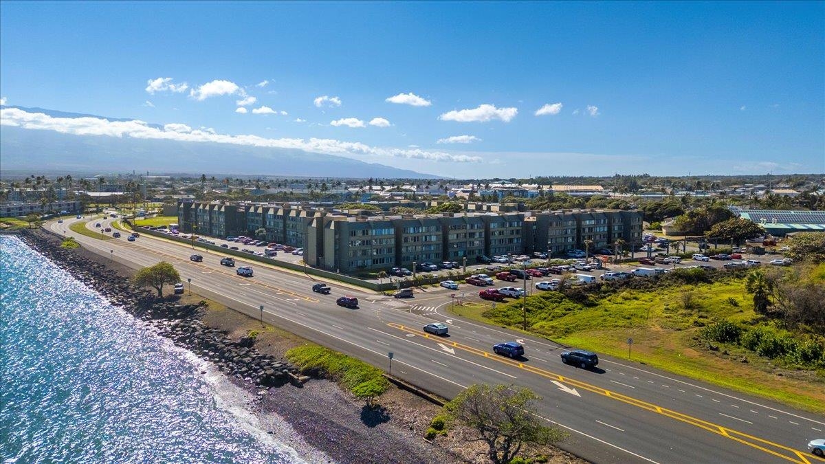 111 Kahului Beach Road, Unit D412 Kahului, HI 96732 - Photo 36 of 37 a view of a swimming pool with a lounge chair