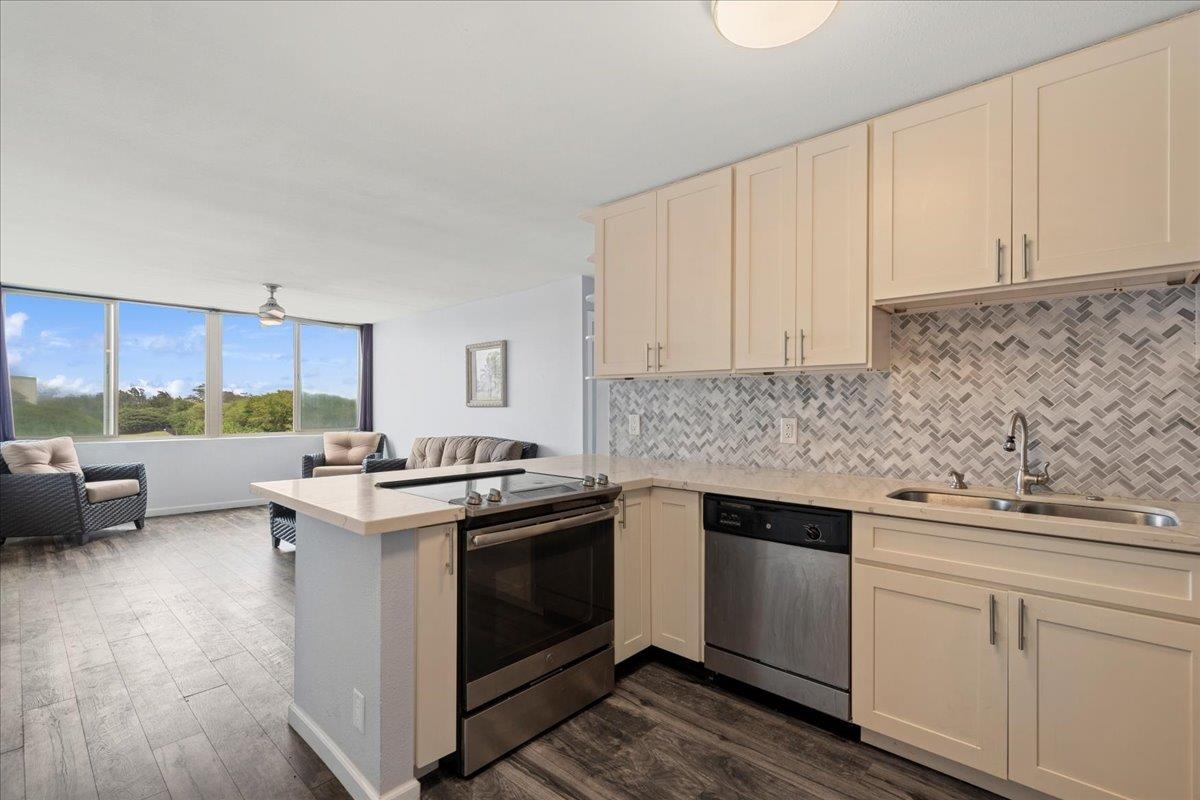 111 Kahului Beach Road, Unit D412 Kahului, HI 96732 - Photo 7 of 37 a kitchen with a stove and a sink